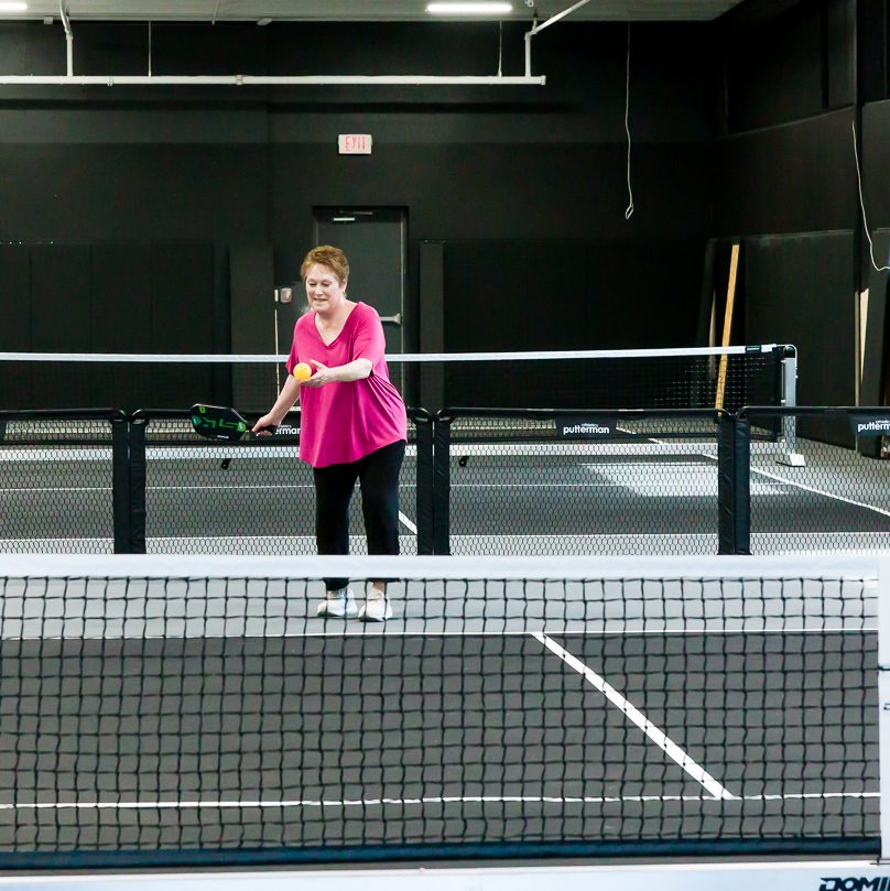 Friends playing pickleball at TOPCOURT LS in Lee's Summit.